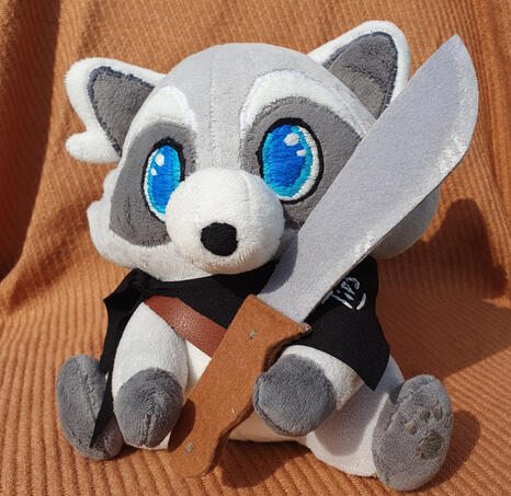 Raton laveur avec une hachette